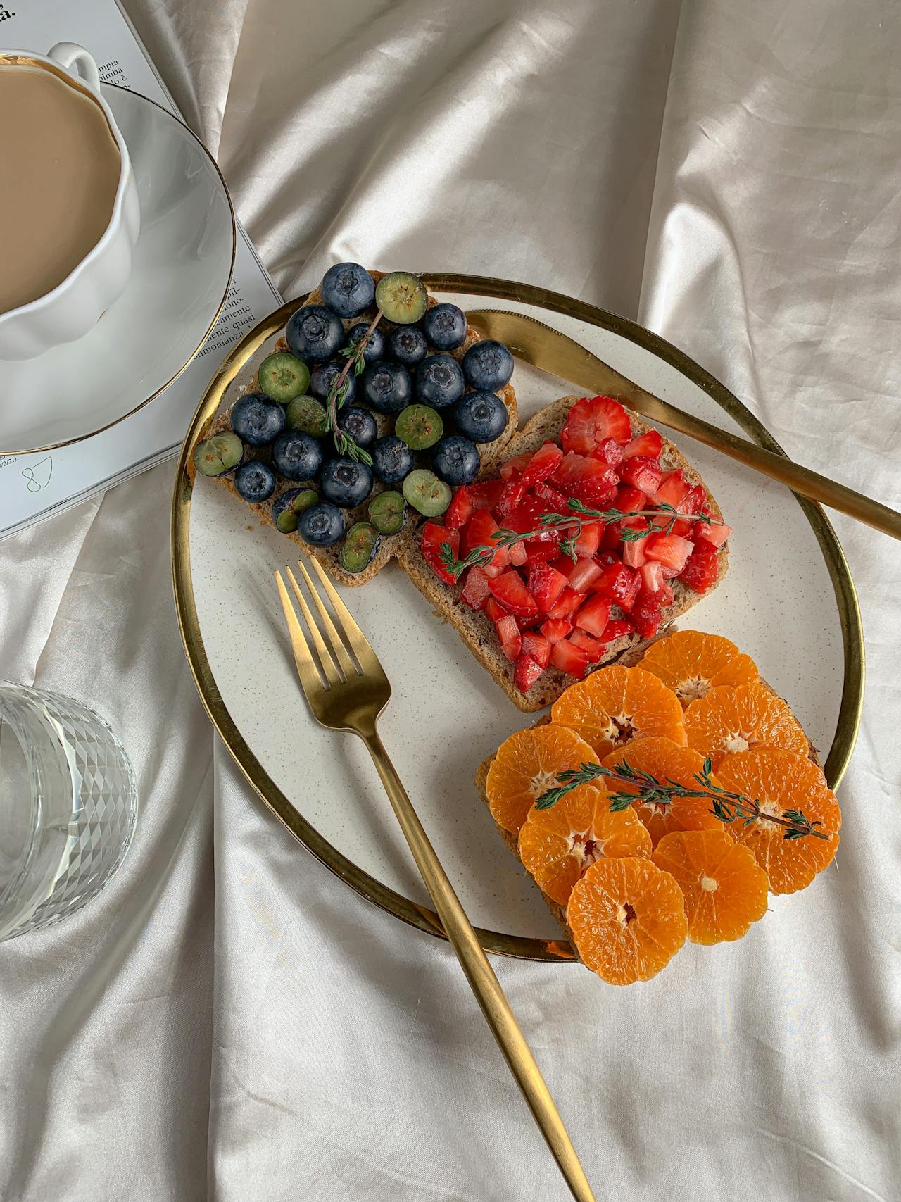 Enjoy a healthy breakfast with fresh fruits, toast, and coffee on elegant tableware