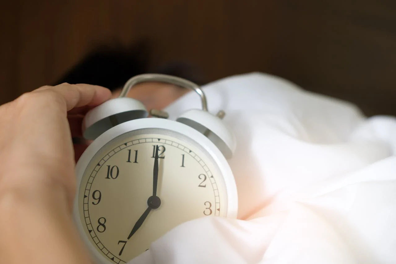Bed sheets with an alarm clock