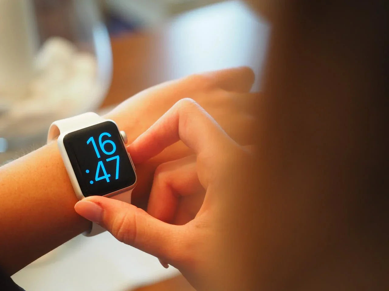 Woman looking at the time on her Apple Watch