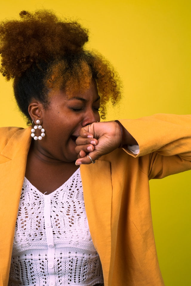 Woman yoaning due to tiredness