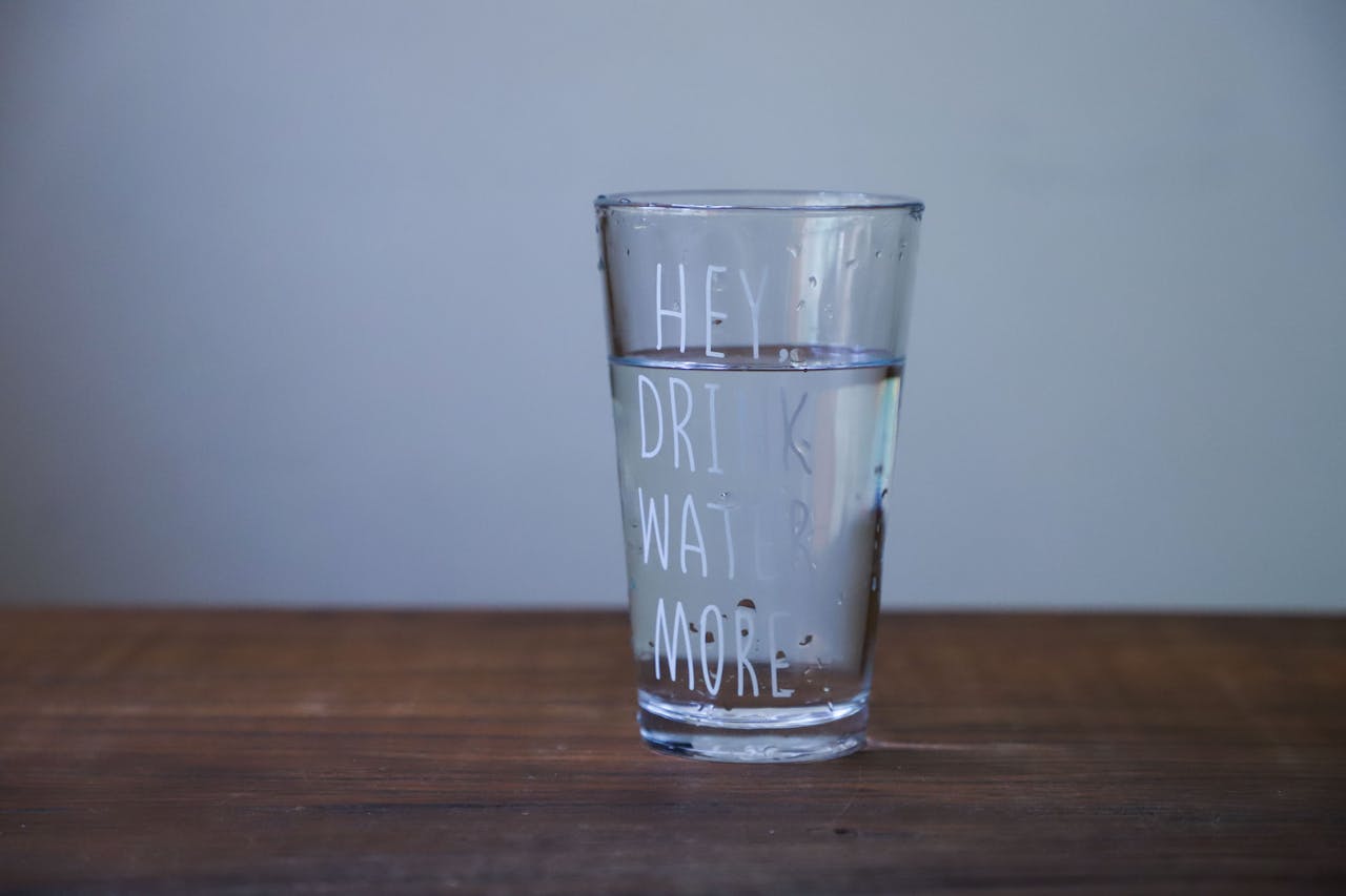 Glass of water on a oak table 