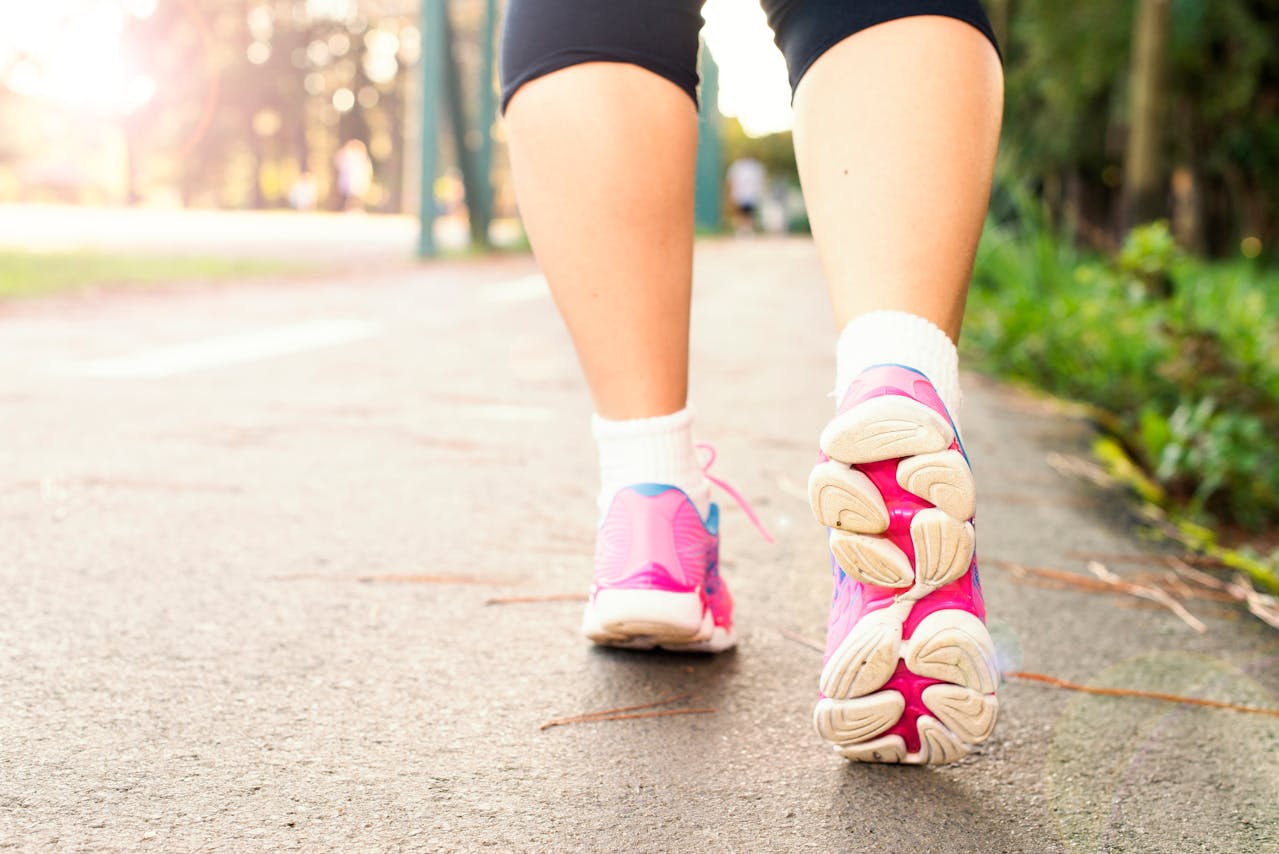 woman walking outside with her gym trainers on